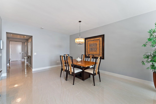 dining space with a chandelier