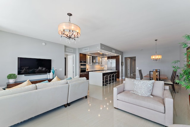 tiled living room with an inviting chandelier and sink