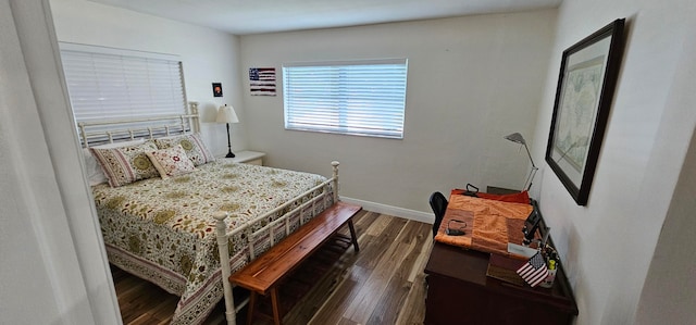 bedroom featuring dark hardwood / wood-style flooring