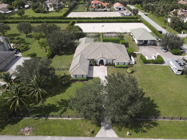 ranch-style home with a front lawn and a garage