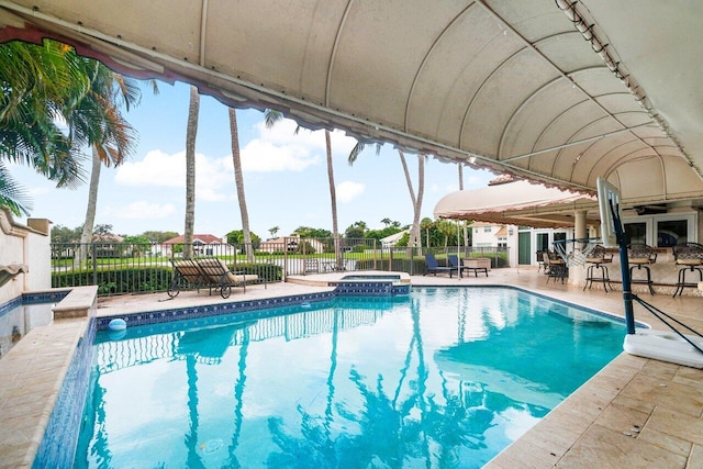 view of pool featuring an in ground hot tub and a patio area