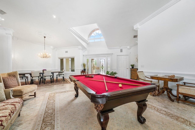 game room featuring a notable chandelier, a high ceiling, pool table, and ornamental molding