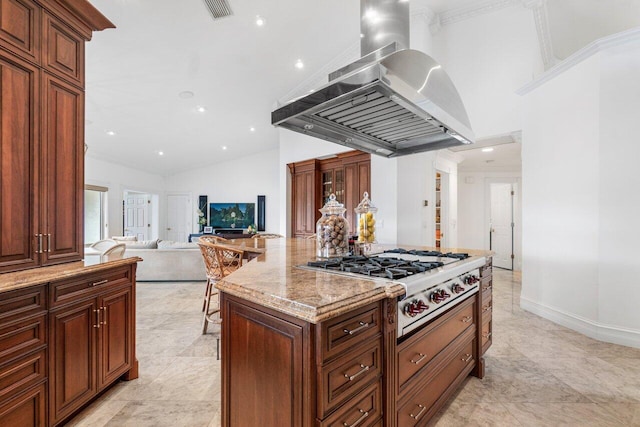 kitchen with light stone counters, stainless steel gas cooktop, island range hood, a kitchen island, and crown molding