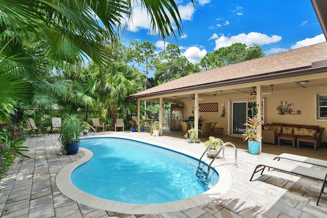 view of pool featuring a patio, ceiling fan, and outdoor lounge area