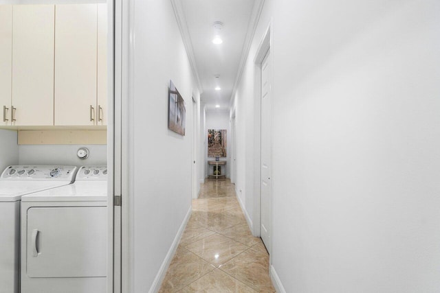 washroom featuring cabinets, washing machine and clothes dryer, light tile patterned floors, and crown molding