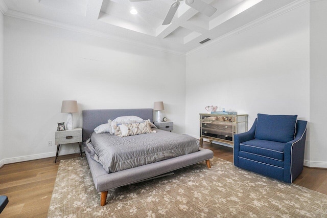 bedroom with ceiling fan, hardwood / wood-style flooring, crown molding, and coffered ceiling