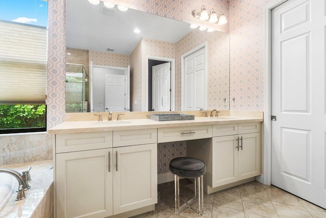 bathroom with vanity, shower with separate bathtub, tile patterned flooring, and a wealth of natural light