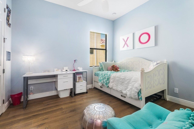 bedroom with ceiling fan and dark wood-type flooring