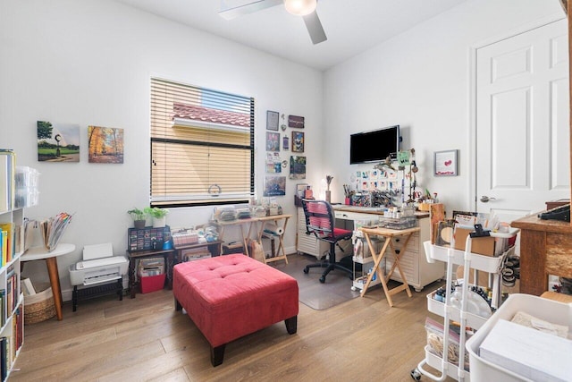 office area with ceiling fan and light hardwood / wood-style floors