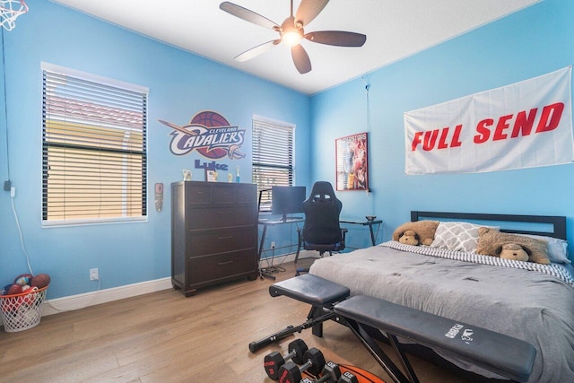 bedroom featuring light hardwood / wood-style flooring and ceiling fan