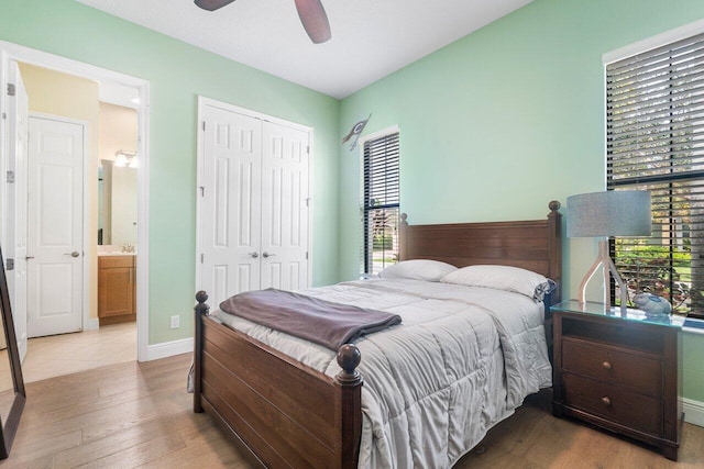 bedroom featuring a closet, ceiling fan, hardwood / wood-style flooring, and ensuite bathroom