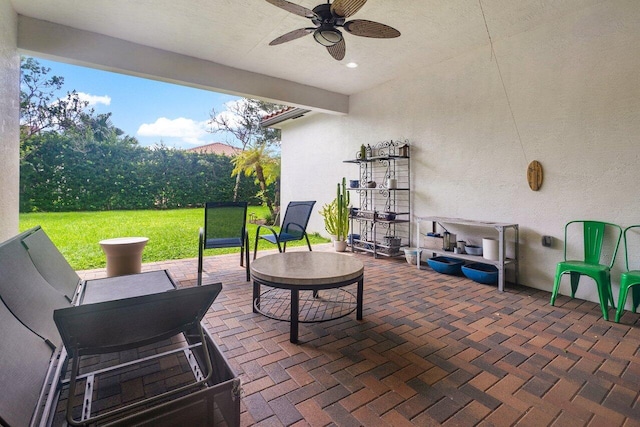 view of patio / terrace featuring ceiling fan