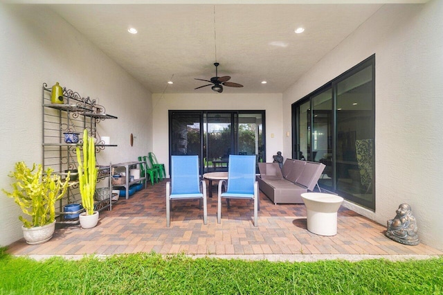 view of patio / terrace featuring ceiling fan