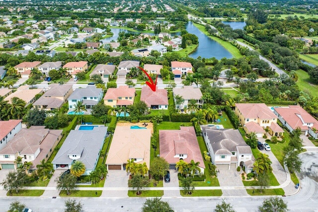 birds eye view of property with a water view