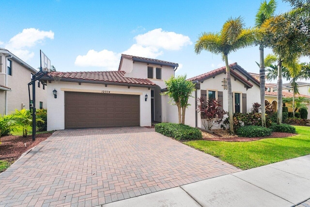 mediterranean / spanish house featuring a garage