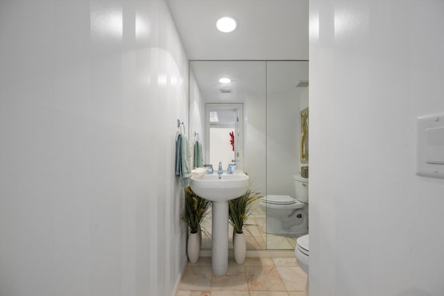 bathroom featuring toilet