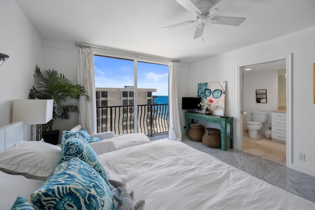 bedroom with ceiling fan, ensuite bath, and access to exterior