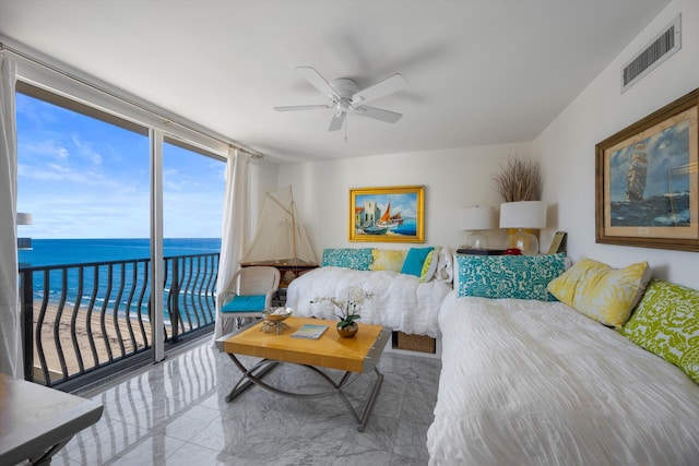 living room featuring a water view and ceiling fan