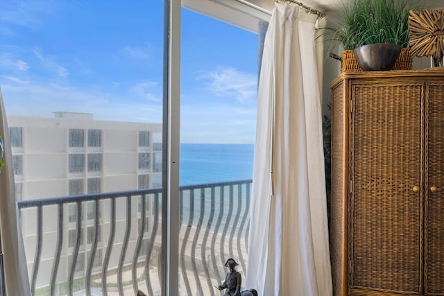 balcony featuring a water view