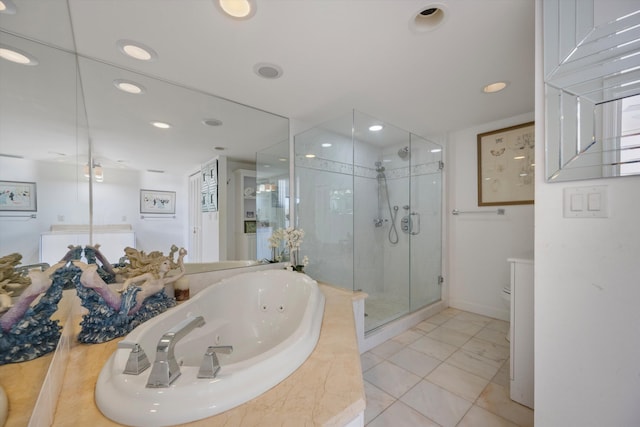 bathroom with shower with separate bathtub and tile patterned floors