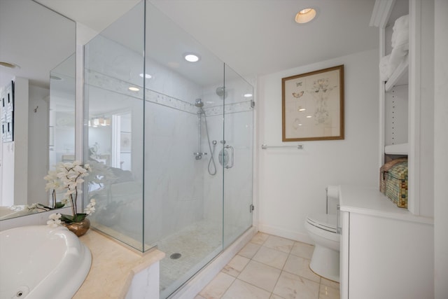 bathroom with toilet, sink, and a shower with shower door