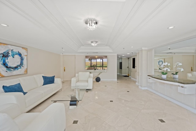 living room featuring a raised ceiling and ornamental molding