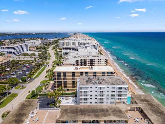 drone / aerial view with a water view and a view of the beach