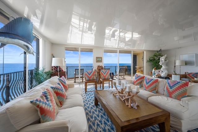 living room featuring a water view