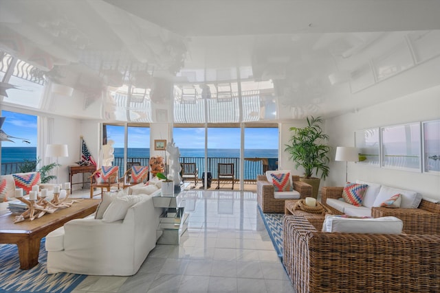 tiled living room with a water view