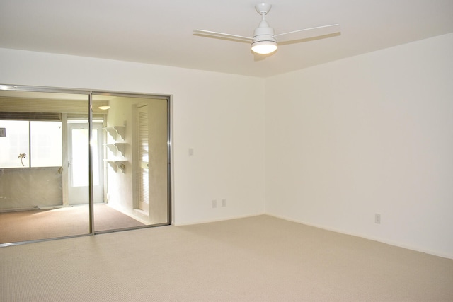 unfurnished bedroom with carpet, a closet, and ceiling fan