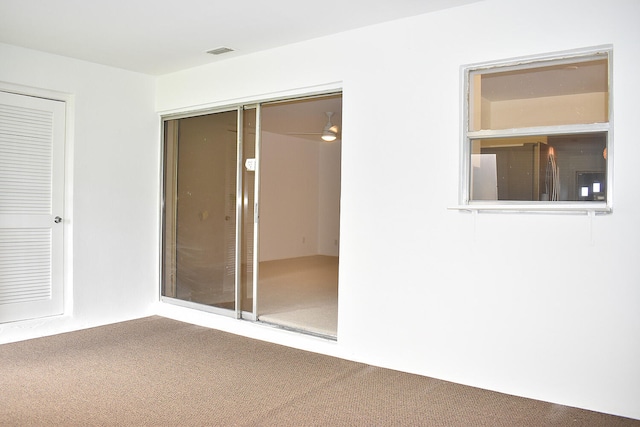 interior space featuring ceiling fan