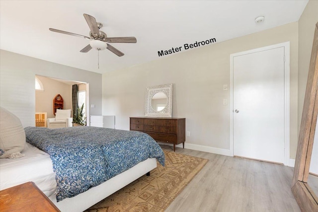 bedroom featuring ceiling fan and hardwood / wood-style floors