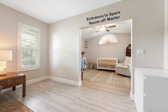 sitting room featuring vaulted ceiling, light hardwood / wood-style floors, and ceiling fan