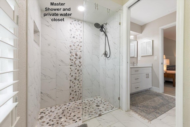 bathroom featuring vanity and a tile shower