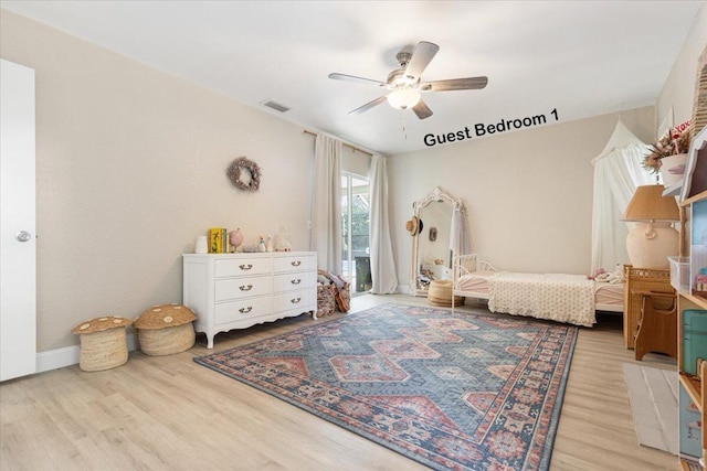 bedroom with ceiling fan and light wood-type flooring