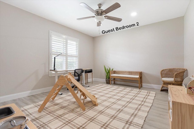 interior space featuring light hardwood / wood-style flooring and ceiling fan