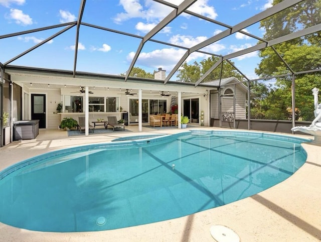 view of pool featuring ceiling fan, a patio, an outdoor hangout area, and glass enclosure