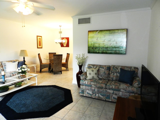 living room featuring ornamental molding, ceiling fan with notable chandelier, and light tile patterned floors