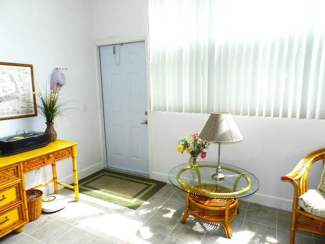 foyer entrance with light tile patterned floors