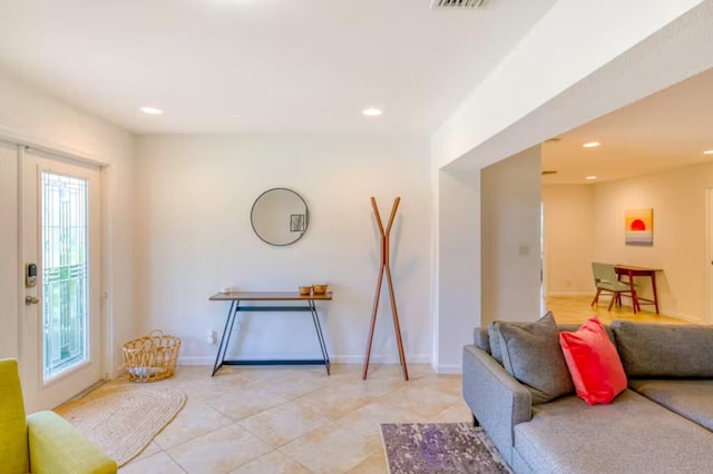 living room with light tile patterned floors