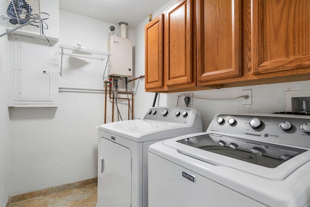 washroom with cabinets, tankless water heater, and washer and clothes dryer