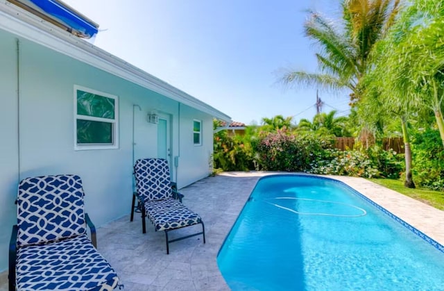 view of swimming pool featuring a patio area