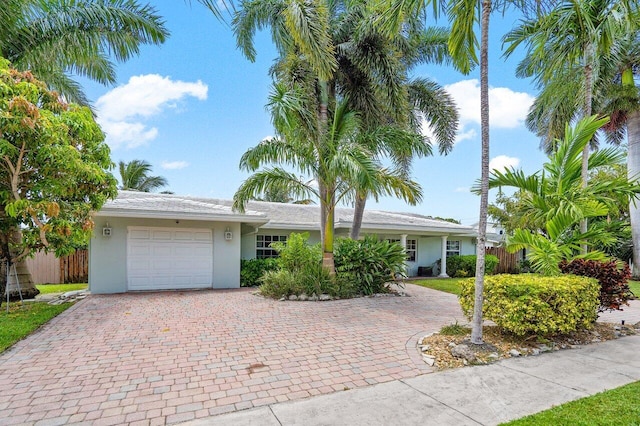 single story home featuring a garage