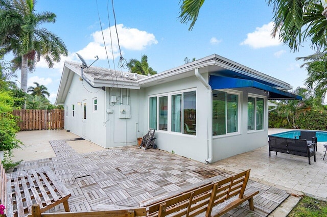 rear view of house with a patio