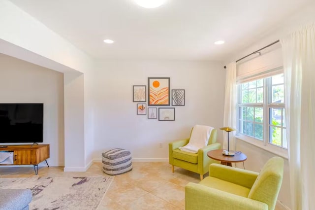 sitting room featuring light tile patterned flooring