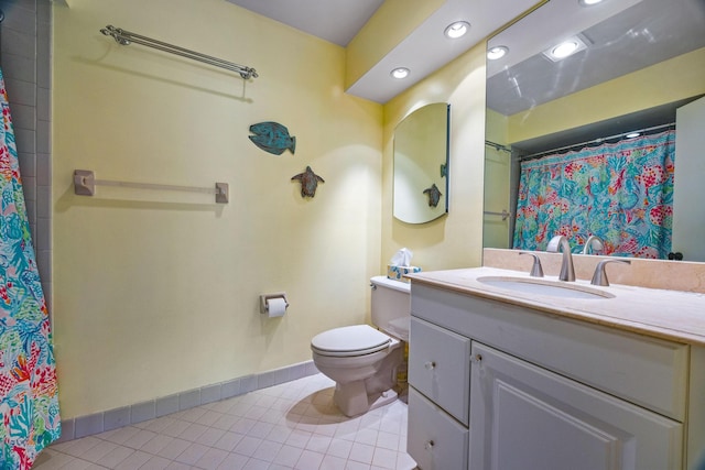 bathroom featuring a shower with shower curtain, vanity, toilet, and tile patterned floors