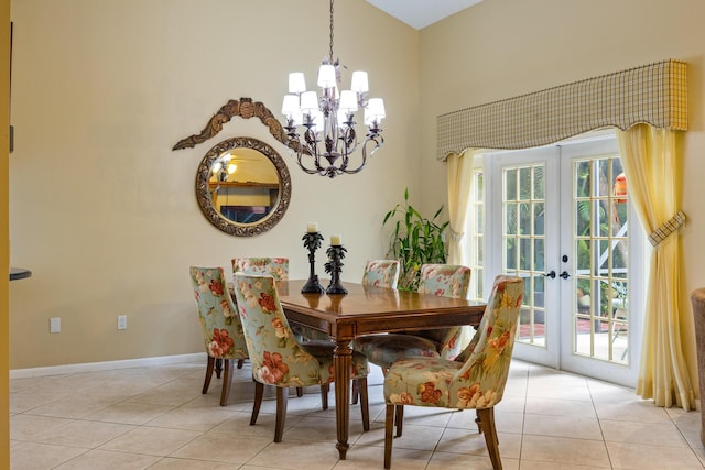 tiled dining space featuring french doors, an inviting chandelier, and a wealth of natural light