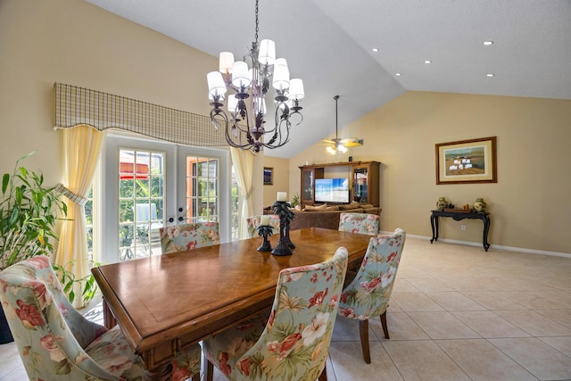 dining area with french doors, a notable chandelier, high vaulted ceiling, and light tile patterned flooring