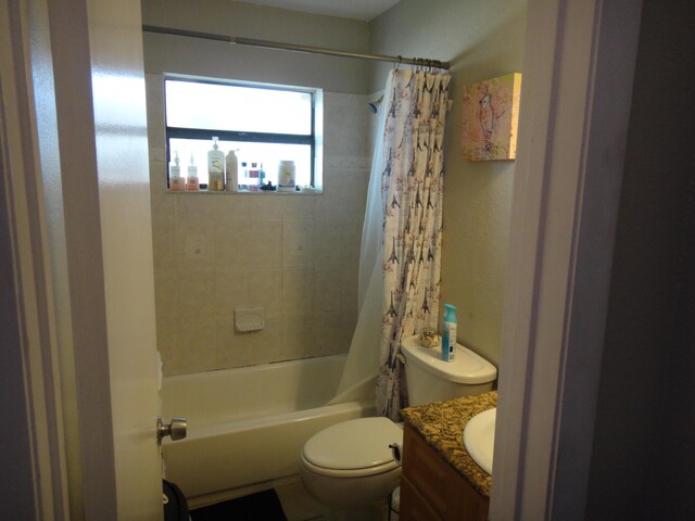 full bathroom featuring shower / bathtub combination with curtain, vanity, and toilet