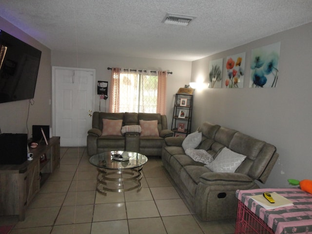 tiled living room with a textured ceiling